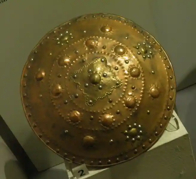 Shield, solar disc, sun disc, four-point, eight-point